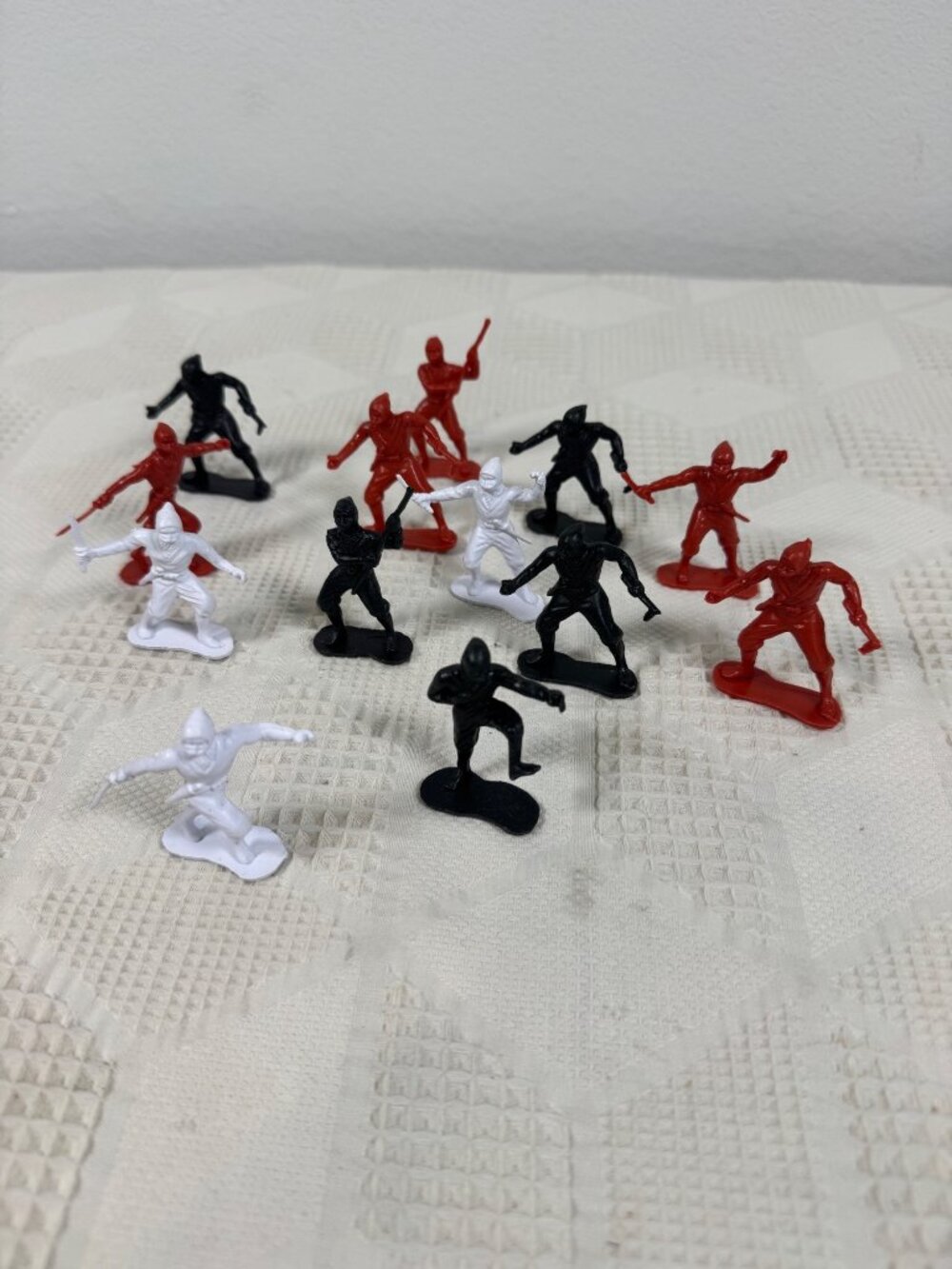 Vintage Plastic Ninja Figurines Set Of 13 In Red Black and White Army Men Style